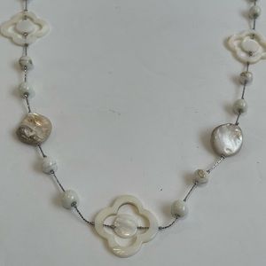 18" long fashion necklace. Silver look and faux abalone.